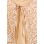 Kristina Ti orange silk blouse with long sleeves and elegant design, perfect for stylish casual or formal wear.