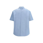 Prada blue cotton short-sleeve shirt with a classic collar and button front, featuring a sleek, minimalist design.