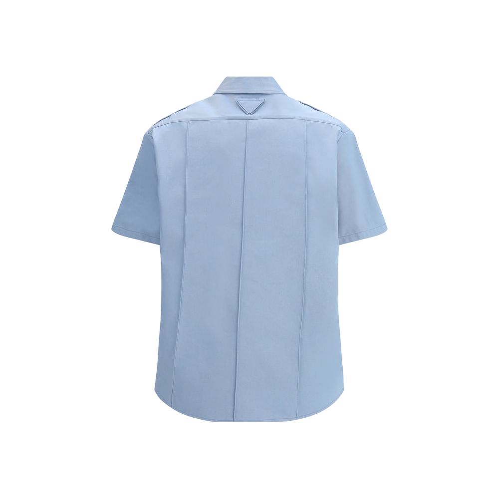 Prada blue cotton short-sleeve shirt with a classic collar and button front, featuring a sleek, minimalist design.