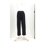 Black cotton casual pants by MM6, featuring a relaxed fit and minimalist design, shown on a plain background.