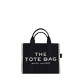 Black cotton Marc Jacobs handbag with structured design and top handles, featuring subtle branding details.