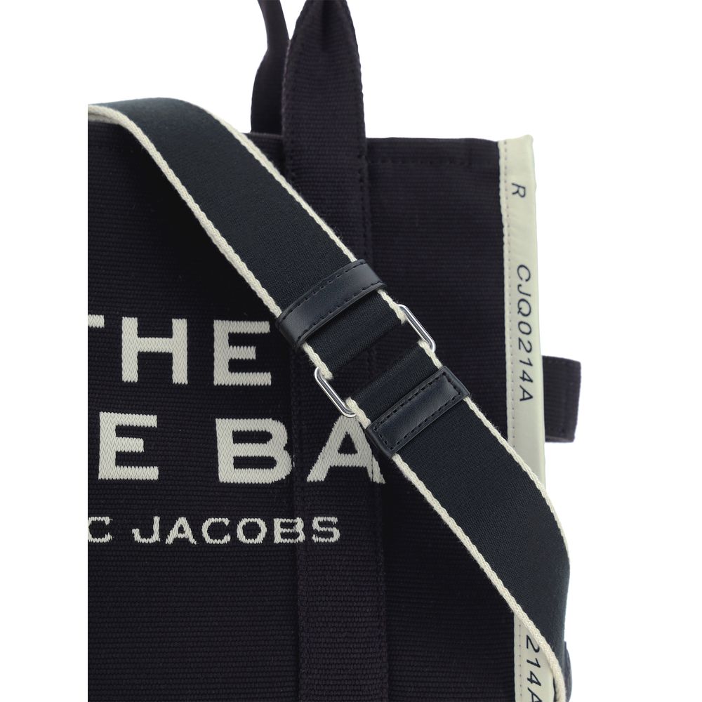 Black cotton Marc Jacobs handbag with sleek design and top handles, featuring subtle branding and minimalist style.