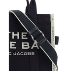 Black cotton Marc Jacobs handbag with sleek design and top handles, featuring subtle branding and minimalist style.