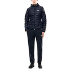 EA7 Emporio Armani blue polyamide shell jacket displayed on a hanger, showcasing its lightweight, water-resistant design.