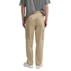 Beige Calvin Klein Jeans cotton cargo pants with multiple pockets and relaxed fit, displayed on a neutral background.