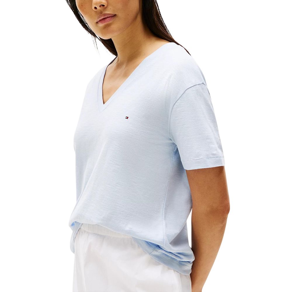 Blue Tommy Hilfiger organic cotton T-shirt with logo detail, casual fit, and soft fabric visible on a plain background.