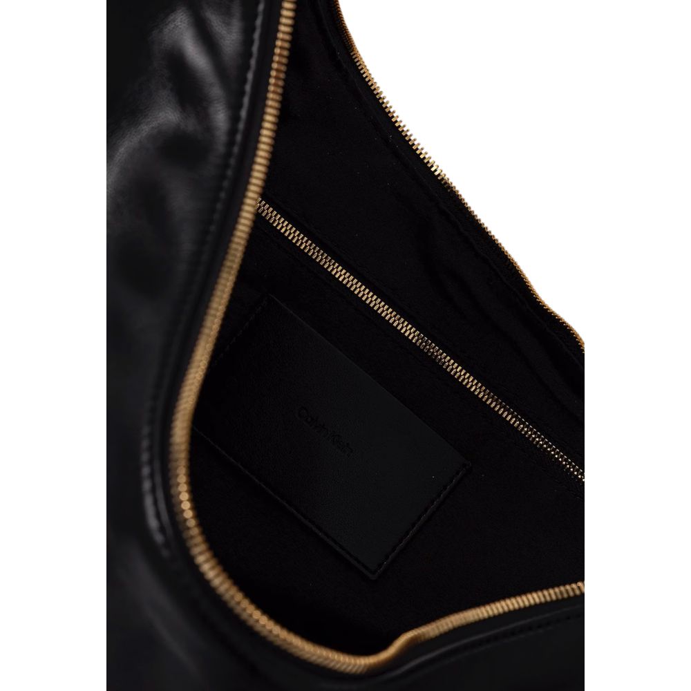Black Calvin Klein polyethylene handbag with sleek design and gold-tone hardware, featuring top handles and a spacious interior.