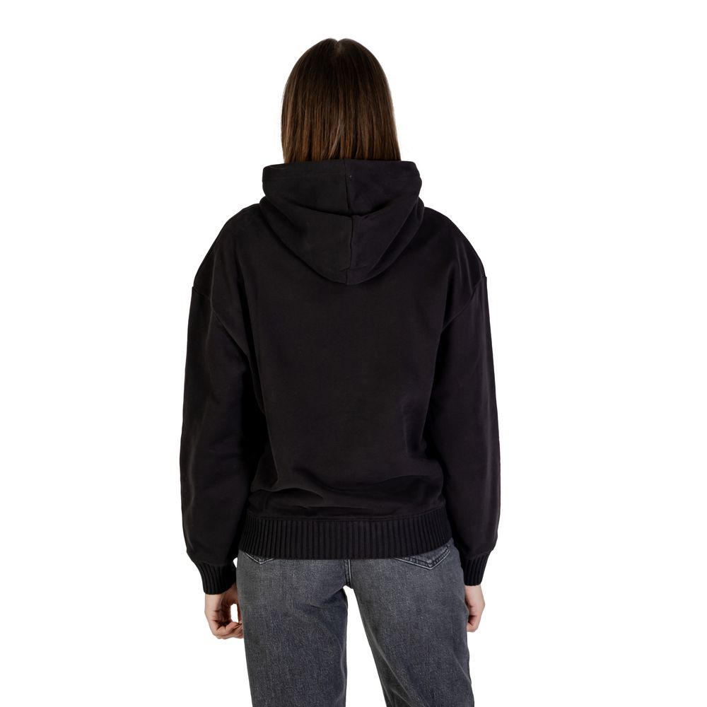 Black cotton hoodie from Calvin Klein Jeans with logo detail, casual fit, and drawstring hood, displayed on a plain background.