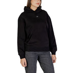 Black cotton hoodie from Calvin Klein Jeans with logo detail, casual fit, and drawstring hood, displayed on a hanger.