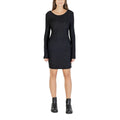 Black polyester short dress by Jacqueline De Yong, featuring a stylish design and fitted silhouette, shown on a model.