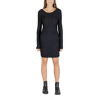 Black polyester short dress by Jacqueline De Yong, featuring a stylish design and fitted silhouette, shown on a model.
