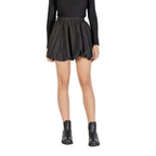Black polyester mini skirt from Jacqueline De Yong, showing a close-up of the fitted waist and smooth fabric texture.