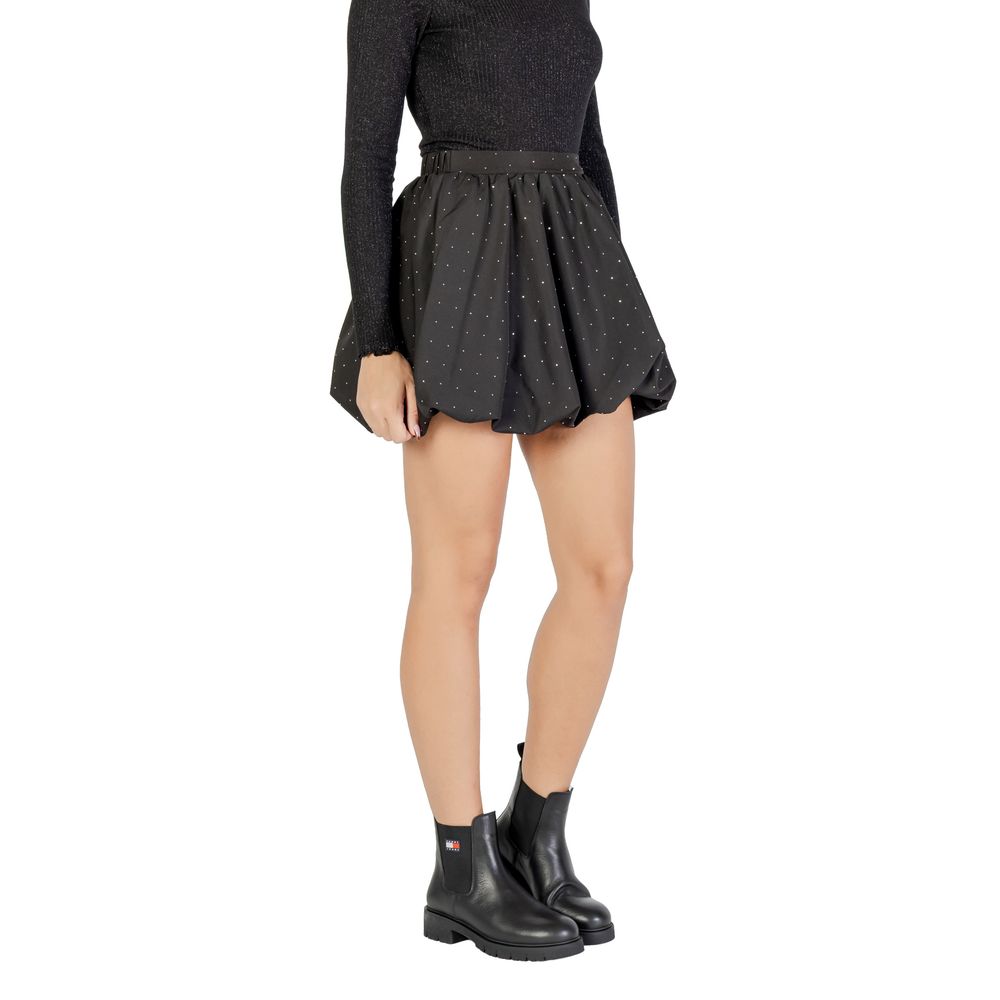 Black polyester mini skirt by Jacqueline De Yong, shown with a close-up of the fabric and waistband detail.