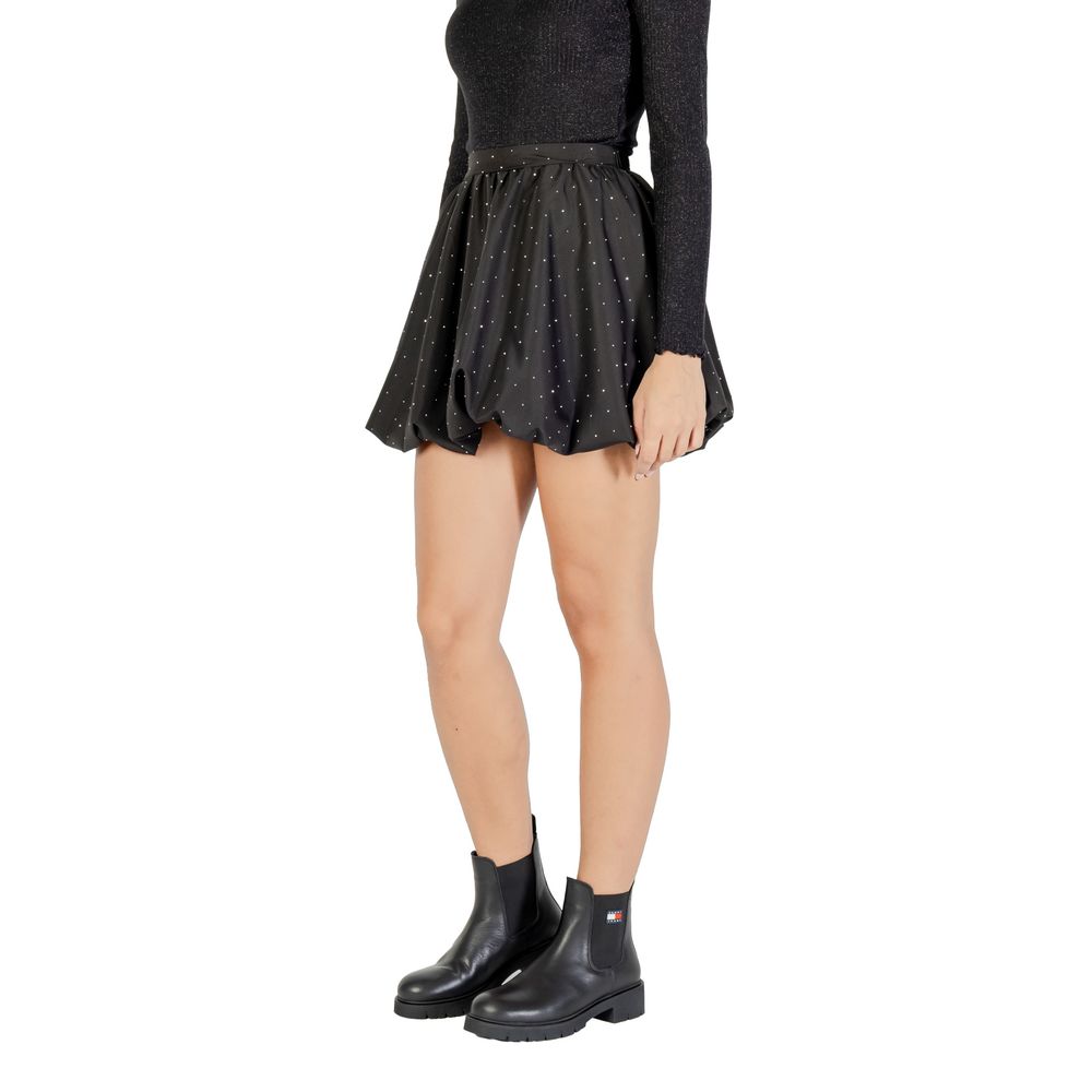 Black polyester mini skirt by Jacqueline De Yong, showcasing a fitted waist and short length, styled for casual or party wear.