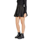 Black polyester mini skirt by Jacqueline De Yong, showcasing a fitted waist and short length, styled for casual or party wear.