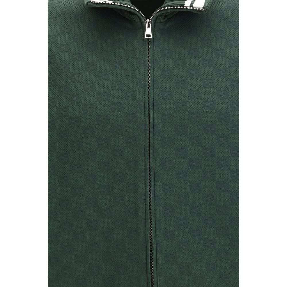 Gucci bicolor polyamide shell jacket with front zipper and adjustable hood, lightweight outdoor outerwear.