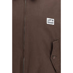 Magliano brown cotton bomber jacket with ribbed cuffs and collar, featuring a classic fit and smooth fabric texture.