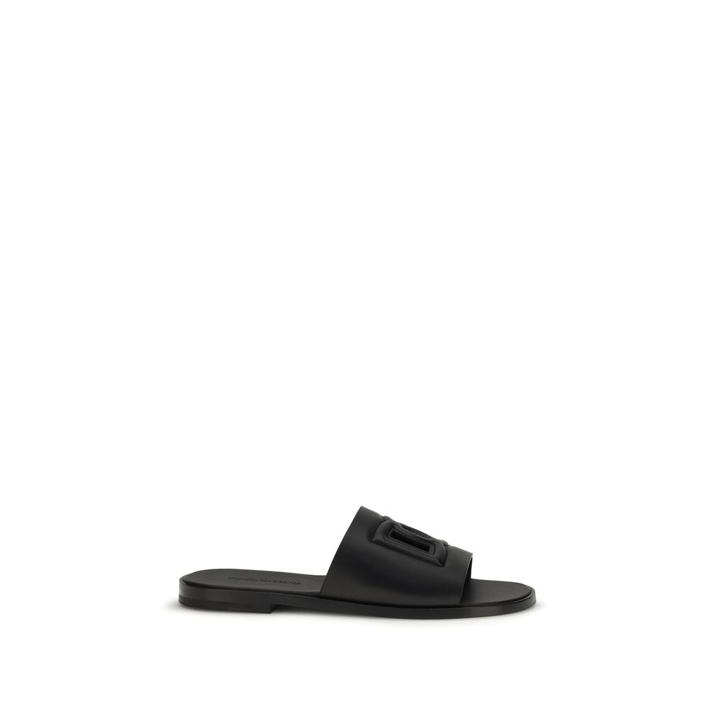 Dolce & Gabbana black calf leather Bos Taurus sandals with open toes and ankle straps, stylish and luxurious footwear.