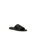 Dolce & Gabbana black calf leather Bos Taurus sandals with open-toe design and ankle strap on white background.