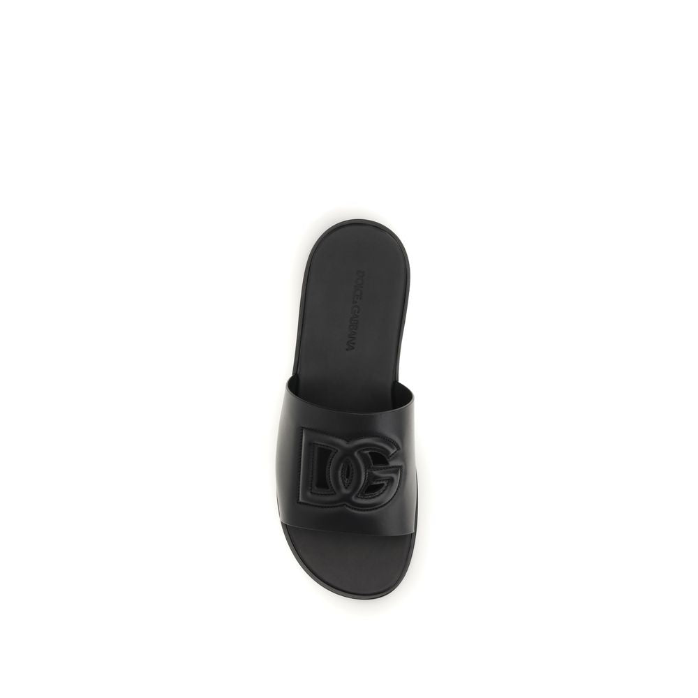 Dolce & Gabbana black calf leather Bos Taurus sandals with open toe and ankle strap, stylish and luxurious footwear.