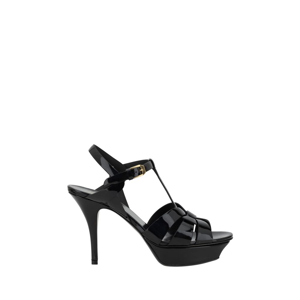 Saint Laurent black calf leather Bos Taurus stiletto heel sandals with ankle straps, showcasing sleek, high-fashion footwear.