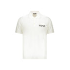 White cotton polo shirt by Balmain, featuring a classic collar and short sleeves, displayed on a neutral background.