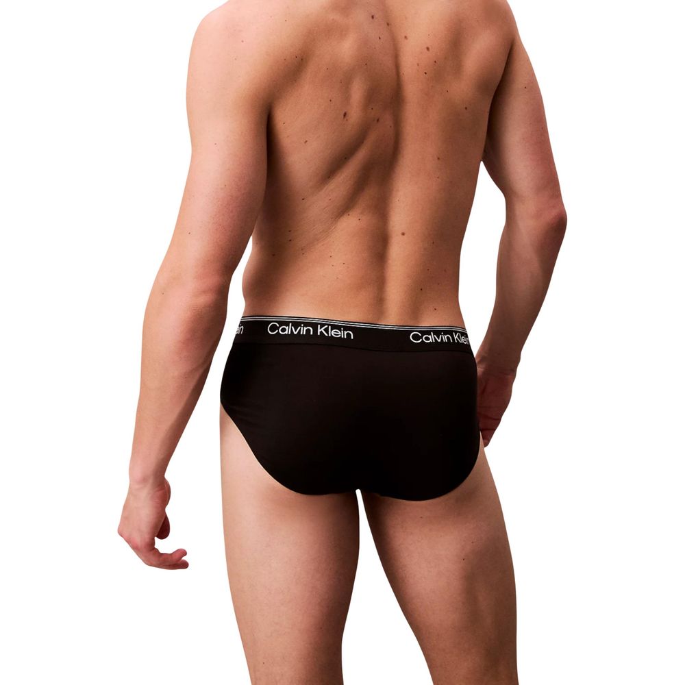 Calvin Klein Underwear black recycled polyester briefs shown on a model, featuring a snug fit and classic waistband for everyday comfort.