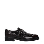 Church's red leather slip-on loafers featuring a sleek design and classic silhouette, perfect for stylish casual or formal wear.