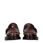 Church's brown leather oxford shoes and derbies, classic men's footwear with polished finish and detailed stitching.