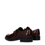 Church's brown leather oxford shoes and derbies, classic men's footwear with polished finish and elegant design.