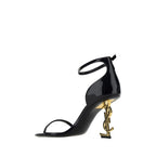 Saint Laurent black calf leather Bos Taurus stiletto heel sandals with ankle straps, stylish and elegant footwear.