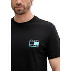 Tommy Hilfiger Jeans black recycled cotton T-shirt with classic crew neck and logo detail, casual and eco-friendly fashion.