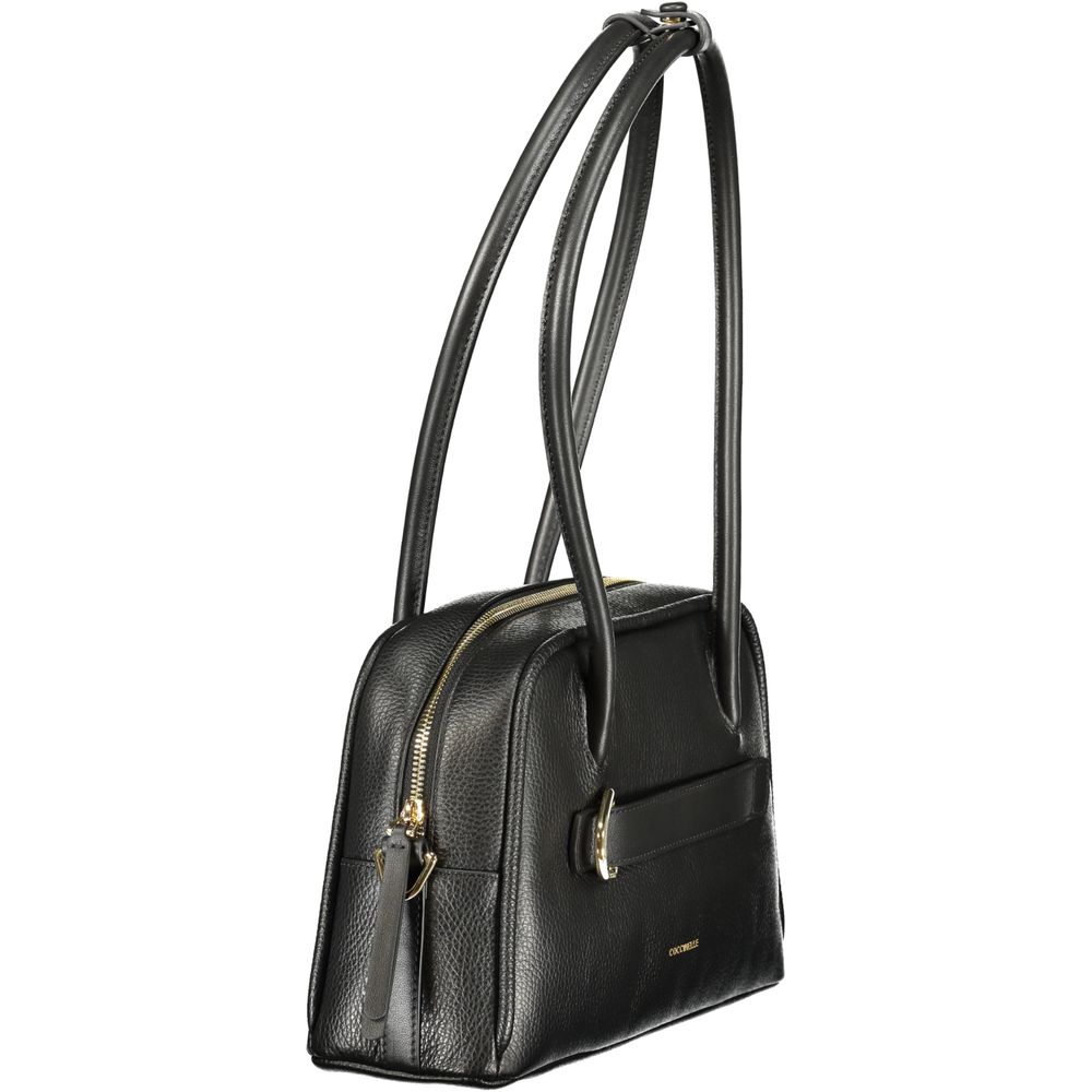 Black Coccinelle leather women’s handbag with sleek design and gold-tone hardware, featuring top handles and a spacious interior.
