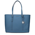 Michael Kors blue leather shoulder bag with gold-tone hardware, showcasing a sleek design and adjustable strap.