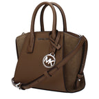 Michael Kors brown leather handbag with gold hardware and structured design, featuring top handles and a spacious interior.
