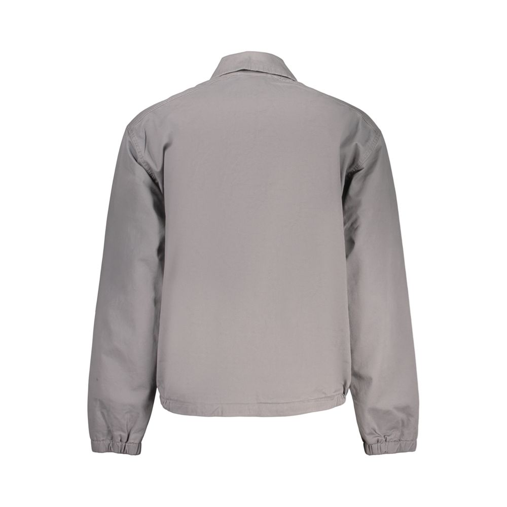 Timberland men's gray cotton jacket displayed on a hanger, featuring a front zipper, collar, and casual style.