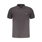 Black Timberland men's cotton polo shirt with a classic collar and short sleeves, displayed on a hanger.