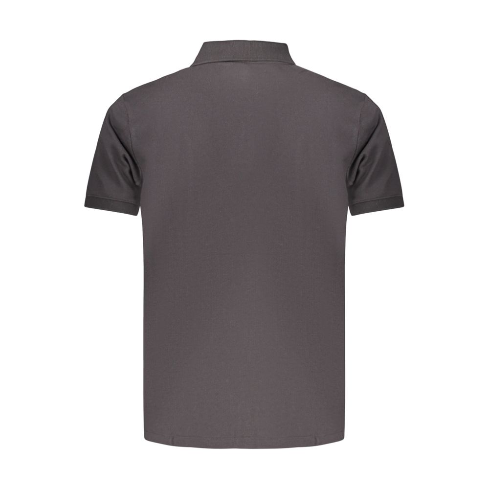 Black cotton men's polo shirt by Timberland, featuring a classic collar and short sleeves, displayed on a neutral background.