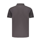 Black cotton men's polo shirt by Timberland, featuring a classic collar and short sleeves, displayed on a neutral background.