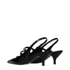 Black leather Celine sandals with open toe and ankle strap, stylish footwear for warm weather.