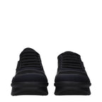 Prada black fabric low top sneakers with white soles and subtle branding, displayed on a neutral background.