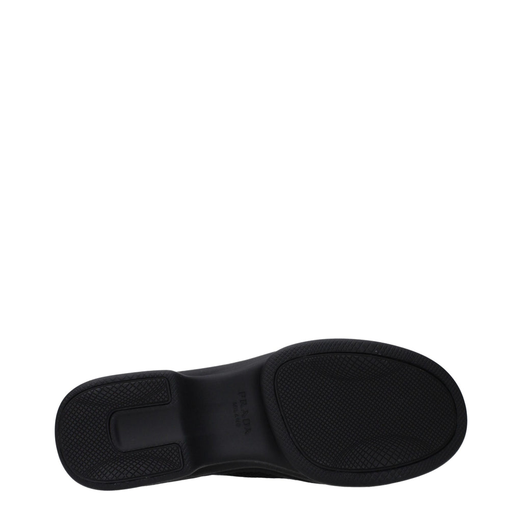 Prada black fabric low-top sneakers with sleek design and white soles, ideal for casual and stylish footwear.