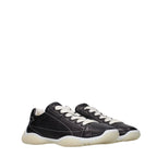Prada black leather sneakers with sleek design and white rubber soles, showcasing stylish and comfortable footwear.