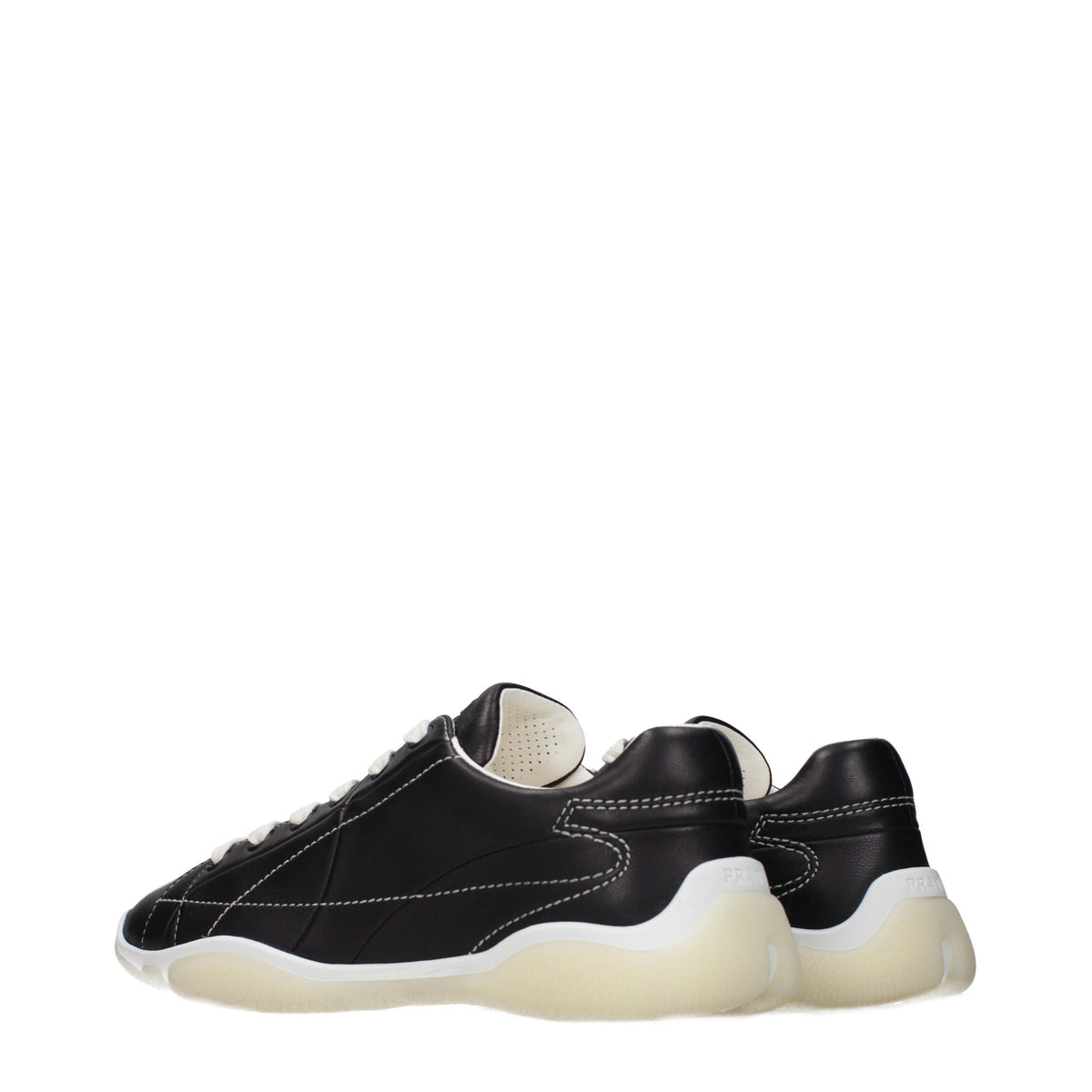 Prada black leather sneakers with sleek design and white rubber soles, showcasing a stylish casual footwear option.