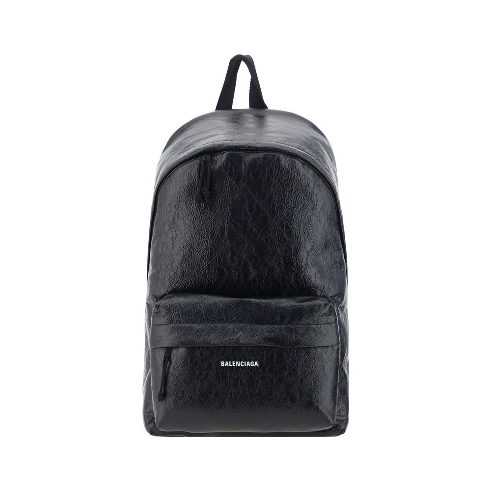 Black calf leather Balenciaga Bos Taurus backpack with sleek design and top handle, featuring silver hardware and adjustable straps.