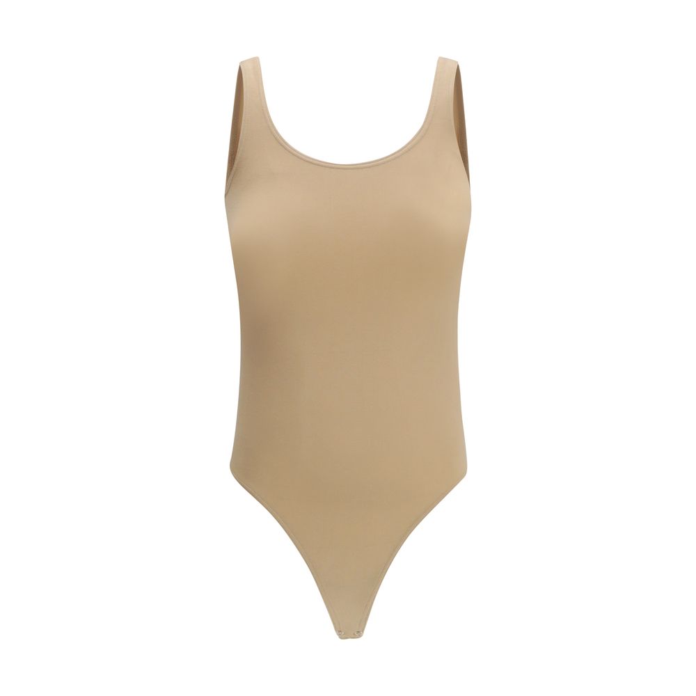 Wolford beige cotton bodysuit displayed on a model, showcasing its fitted design and smooth fabric for comfortable wear.