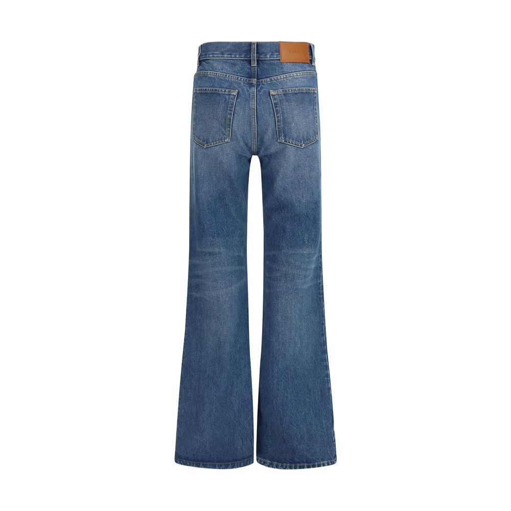 Chloé blue cotton flared jeans with high waist and wide-leg design, styled with casual top and accessories.