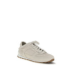 Beige calf leather Brunello Cucinelli Bos Taurus low top sneakers with white rubber soles and subtle branding.