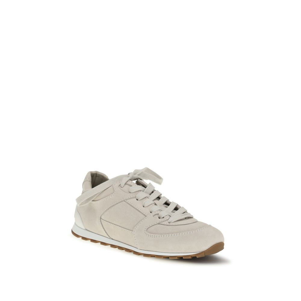 Beige calf leather Brunello Cucinelli Bos Taurus low top sneakers with white rubber soles and subtle branding.