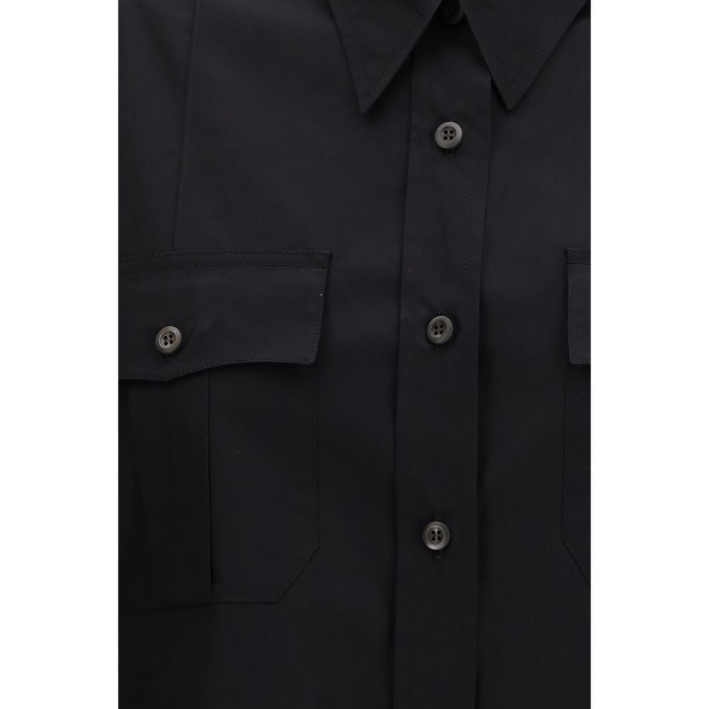 Prada black cotton short-sleeve shirt with a classic collar and relaxed fit, displayed on a hanger.